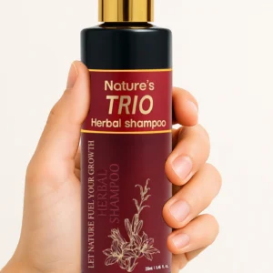 Herbal shampoo bottle in hand – chemical-free shampoo in Pakistan